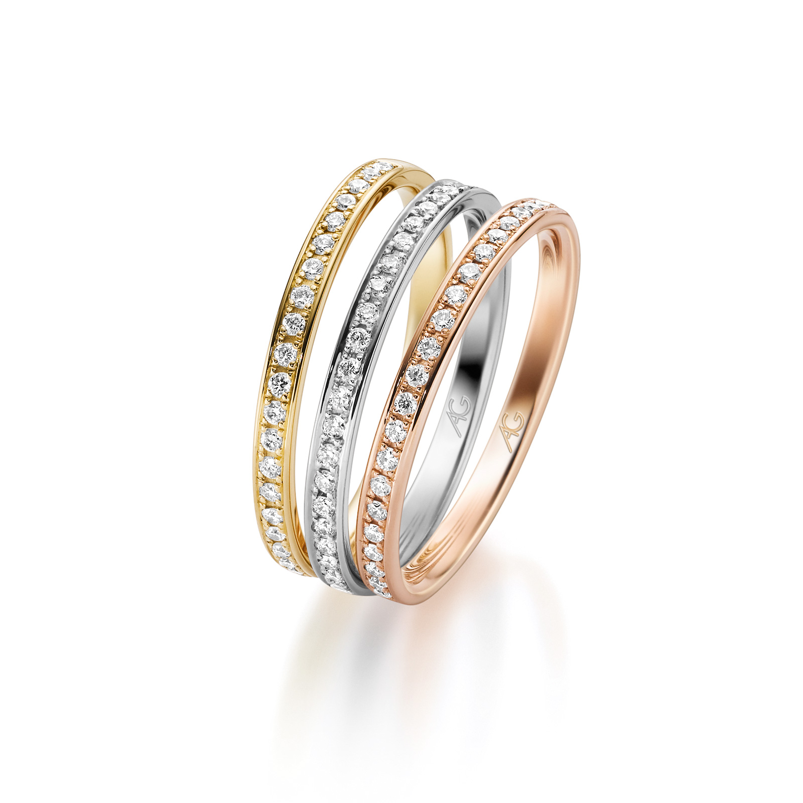 Drei rundum gefasste Memoire-Ringe aus Gelbgold, Weissgold und Roségold